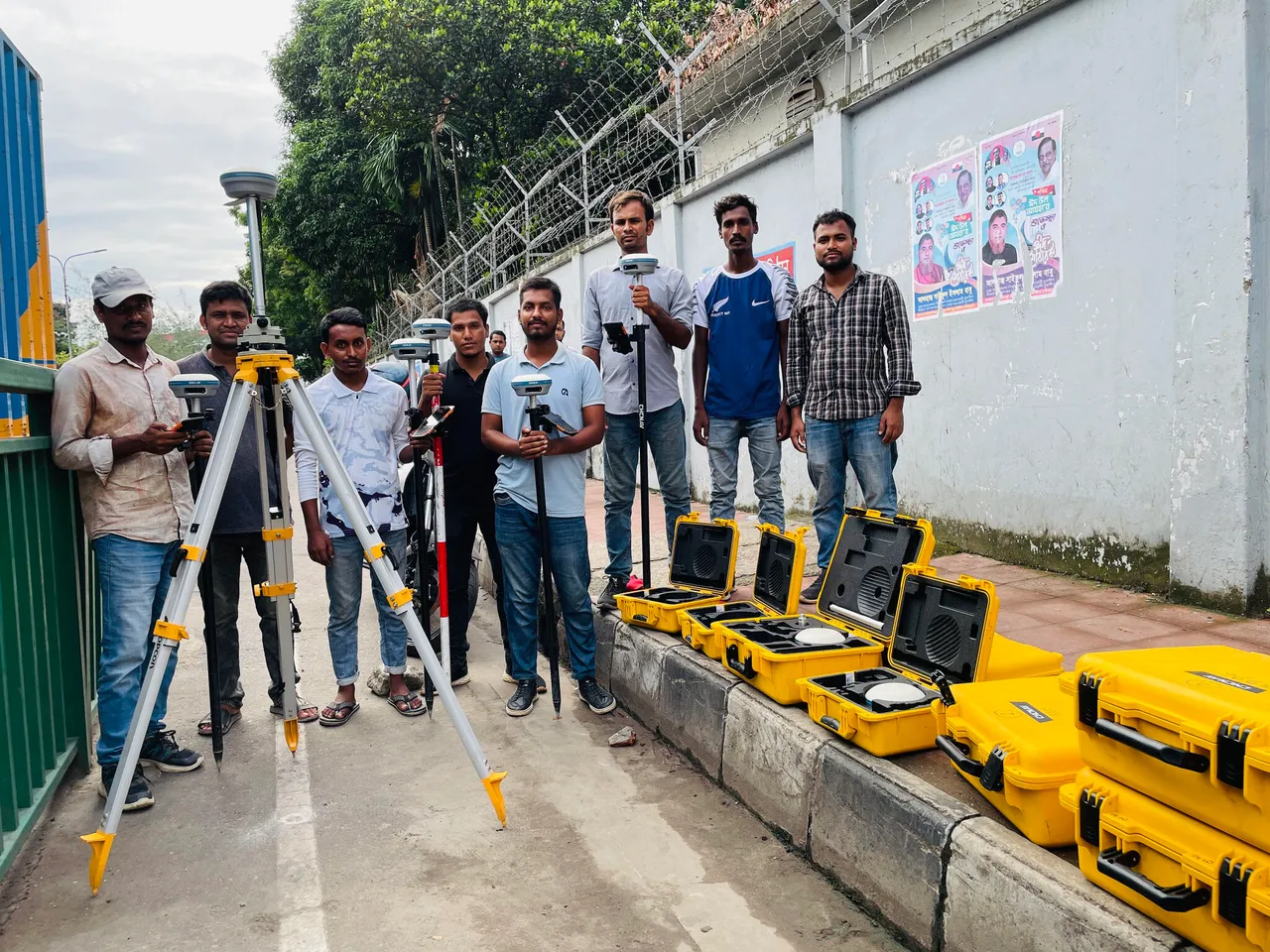 GIS surveyors conducting field surveys using advanced GNSS and GIS equipment